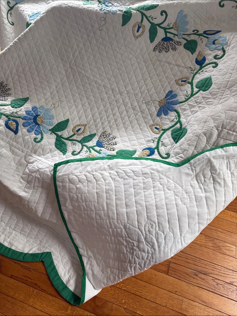 White Quilted Floral Bedspread with Blue and Green Accents